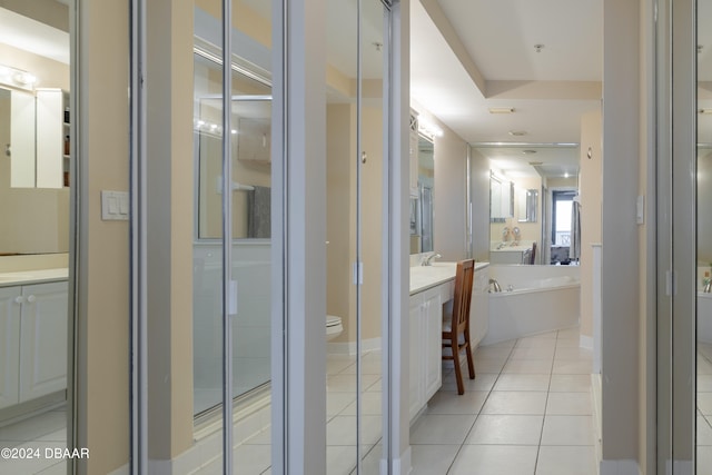 full bathroom with vanity, tile patterned flooring, toilet, and separate shower and tub