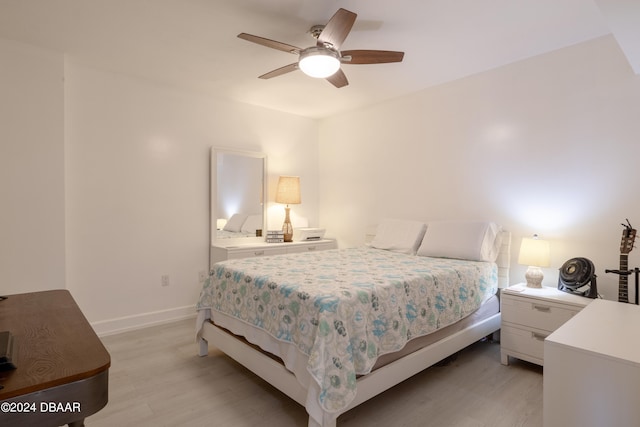 bedroom featuring light wood-type flooring and ceiling fan