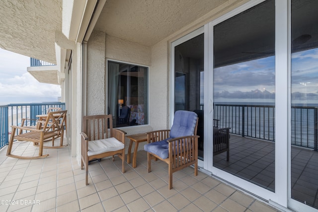 balcony featuring a water view