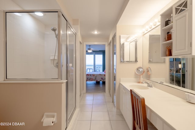 bathroom with vanity, tile patterned floors, ceiling fan, and a shower with shower door