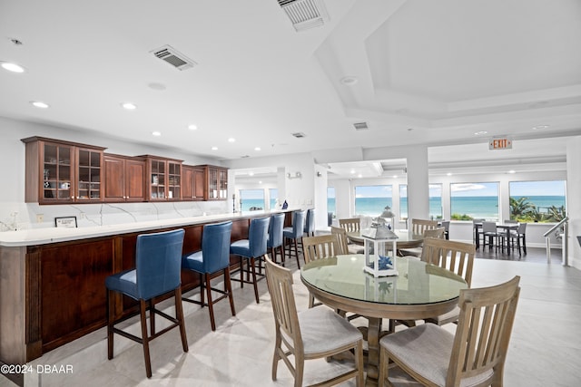 dining space with a water view