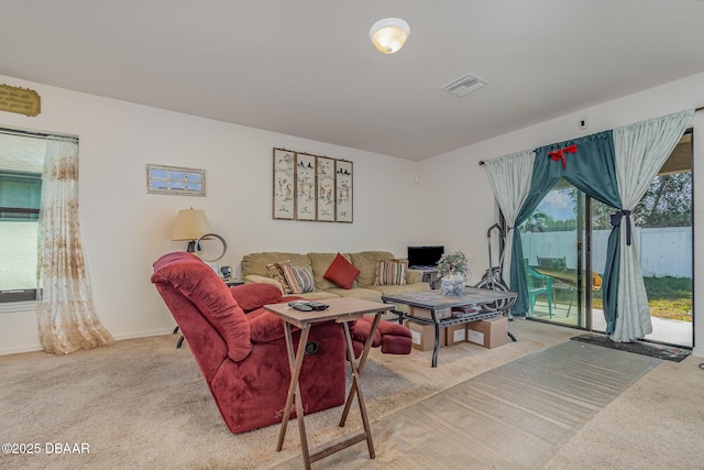 living room featuring light colored carpet