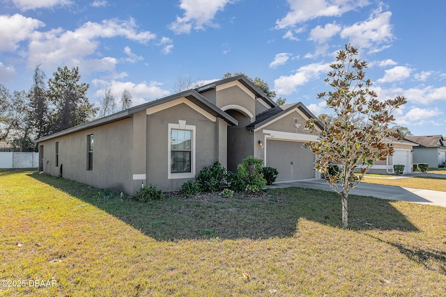 ranch-style house featuring a garage and a front lawn