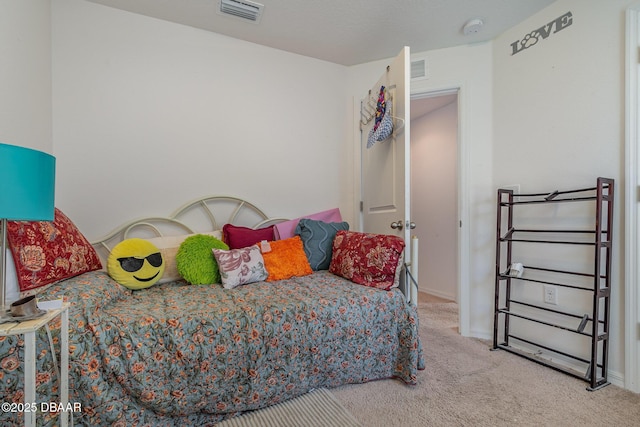 bedroom featuring light colored carpet