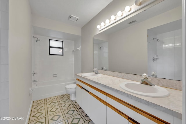 full bath featuring a sink, toilet, double vanity, and washtub / shower combination