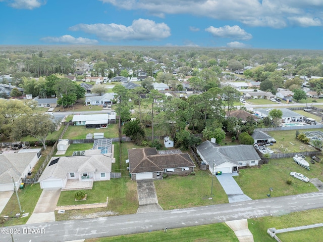 birds eye view of property with a residential view