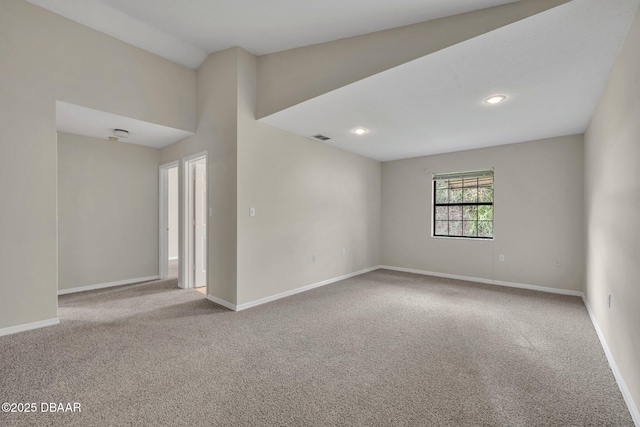 spare room with visible vents, recessed lighting, baseboards, and carpet floors