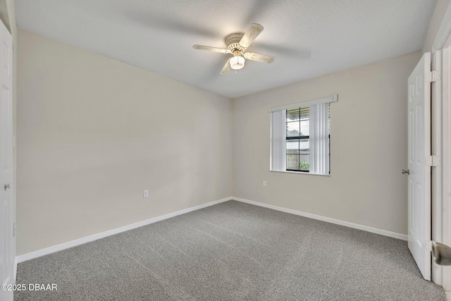 unfurnished bedroom with baseboards, ceiling fan, and carpet flooring