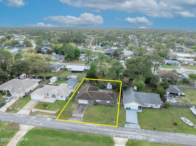 birds eye view of property with a residential view