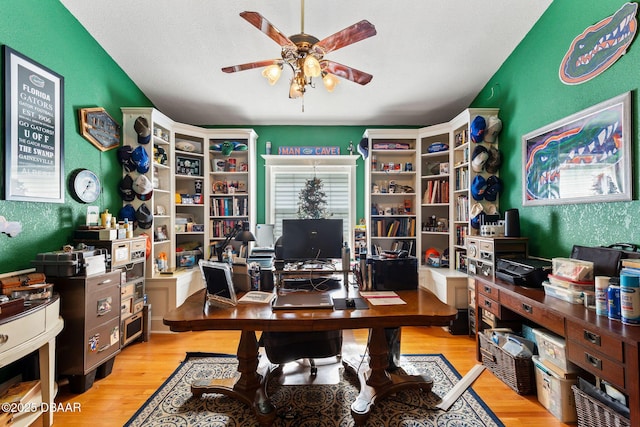 office area with ceiling fan, a textured ceiling, and light wood-type flooring