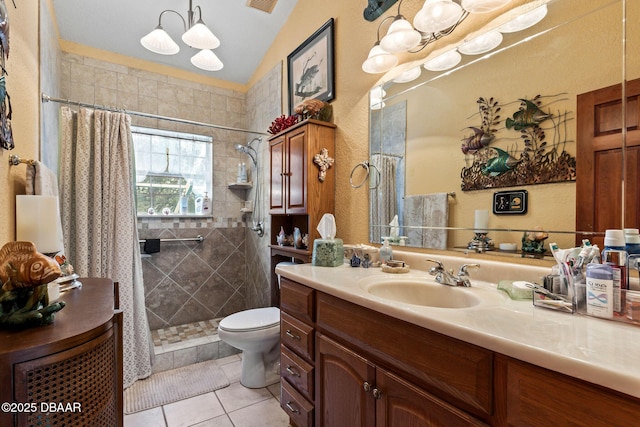 bathroom featuring toilet, vanity, tile patterned floors, and curtained shower