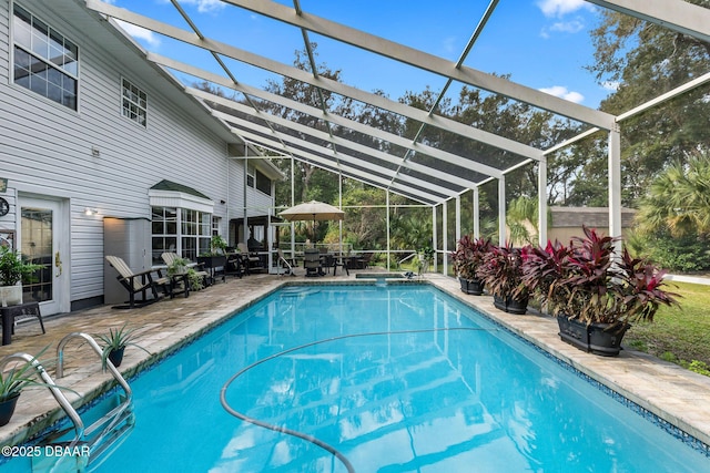 view of pool featuring a patio and a lanai