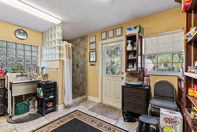 interior space with light tile patterned floors and a wealth of natural light