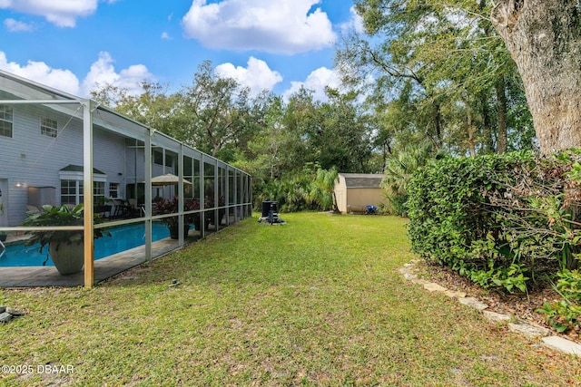 view of yard with glass enclosure and a shed