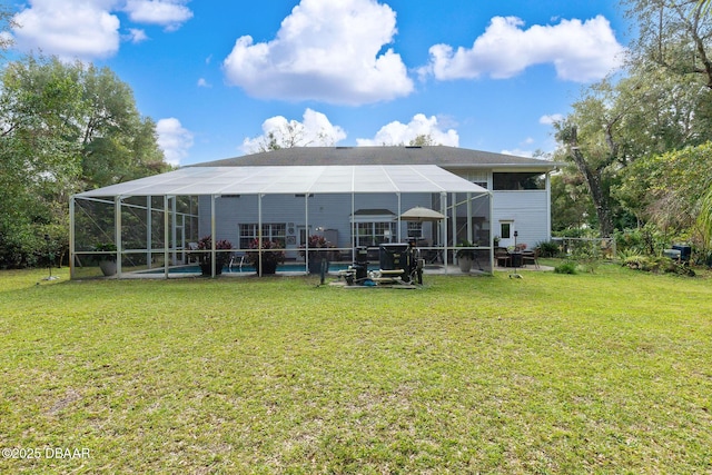 back of house featuring a lawn, glass enclosure, and a swimming pool