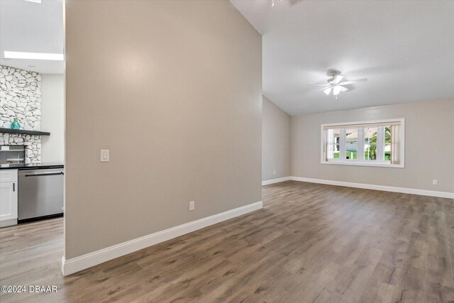 10 Falls Pl, Palm Coast, FL 32137 - unfurnished living room with ceiling fan, light wood-style flooring, baseboards, and lofted ceiling