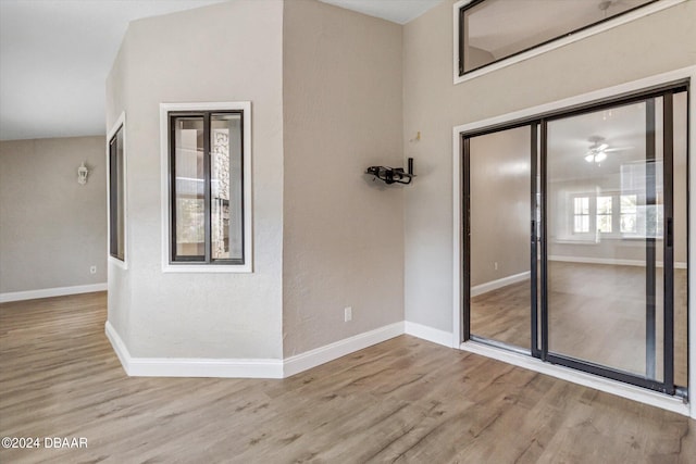 10 Falls Pl, Palm Coast, FL 32137 - unfurnished room with wood finished floors, baseboards, and a ceiling fan