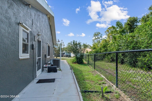 10 Falls Pl, Palm Coast, FL 32137 - view of yard featuring central AC unit and a patio area