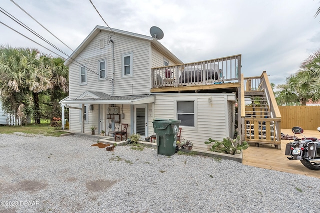 back of property with a wooden deck