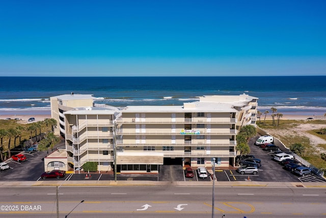 bird's eye view featuring a beach view and a water view