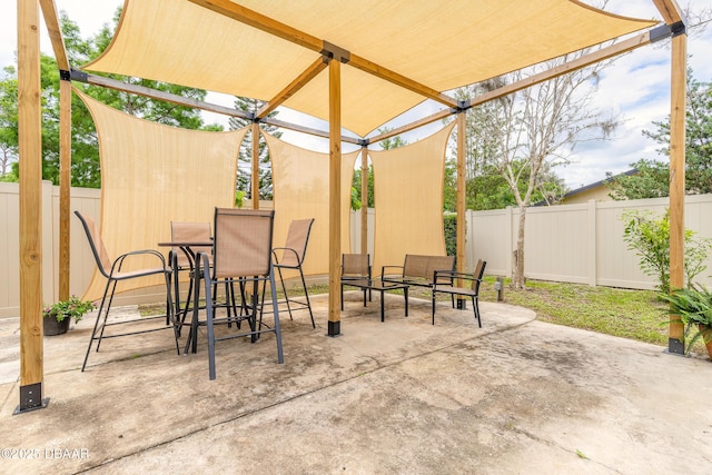 92 S Orchard St, Ormond Beach, FL 32174 - fenced backyard with a patio area and outdoor dining area