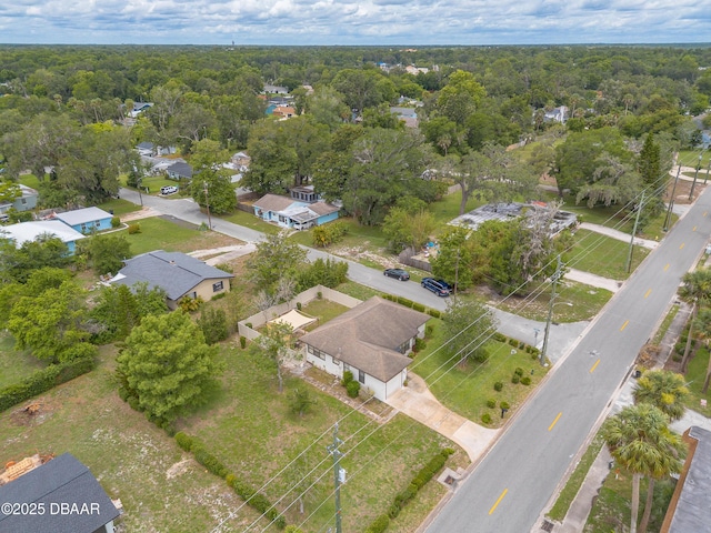 92 S Orchard St, Ormond Beach, FL 32174 - aerial view of property and surrounding area featuring nearby suburban area and a heavily wooded area