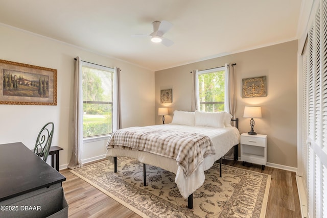 92 S Orchard St, Ormond Beach, FL 32174 - bedroom featuring crown molding, light wood finished floors, baseboards, and a ceiling fan