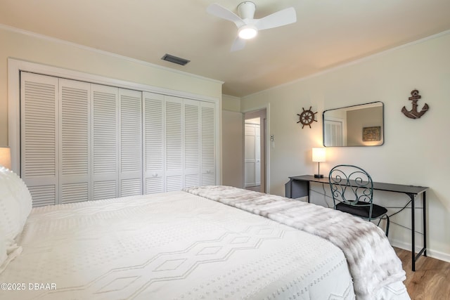 92 S Orchard St, Ormond Beach, FL 32174 - bedroom with a closet, wood finished floors, ornamental molding, ceiling fan, and baseboards
