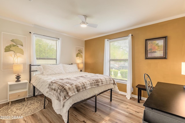 92 S Orchard St, Ormond Beach, FL 32174 - bedroom with light wood-type flooring, ornamental molding, baseboards, and a ceiling fan