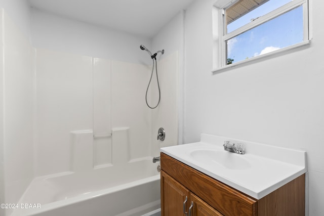 bathroom featuring shower / bath combination and vanity