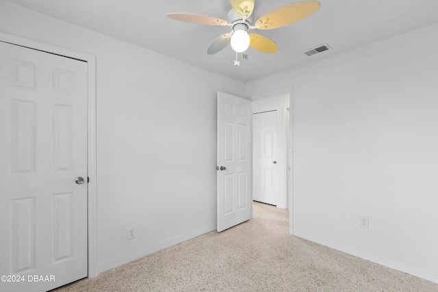 unfurnished bedroom featuring ceiling fan