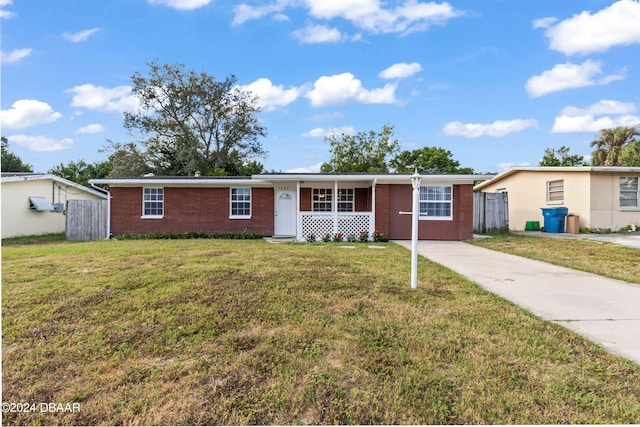 1408 Columbia Dr, Daytona Beach, FL 32117 - single story home with covered porch and a front lawn