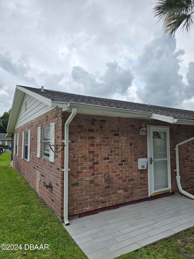 view of side of home featuring a patio area