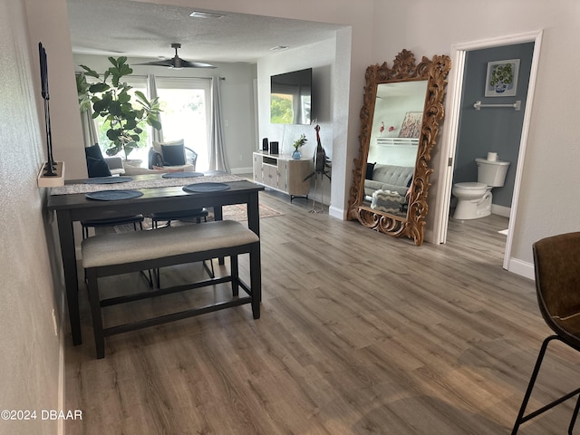 1021 Alabama Ave, Holly Hill, FL 32117 - dining area with wood finished floors, ceiling fan, and baseboards