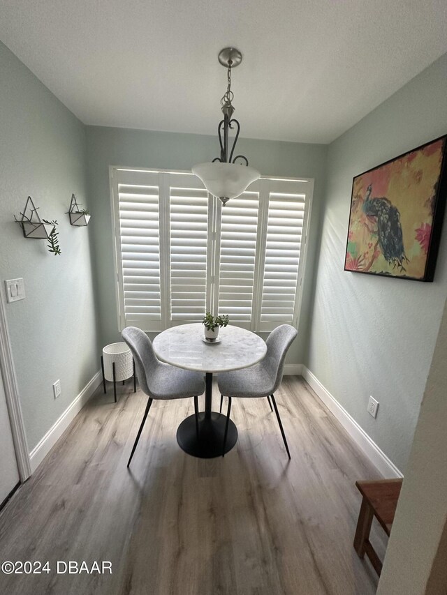 1021 Alabama Ave, Holly Hill, FL 32117 - dining room featuring wood finished floors and baseboards