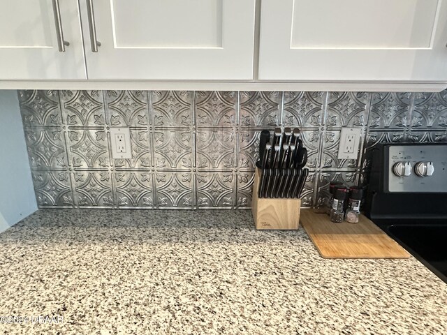 1021 Alabama Ave, Holly Hill, FL 32117 - kitchen view of white cabinets and light stone counters