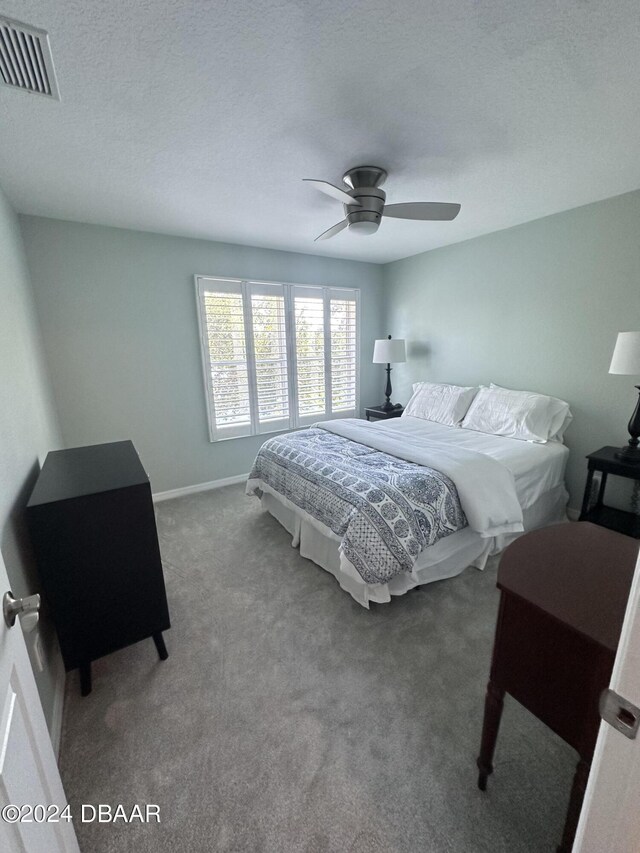 1021 Alabama Ave, Holly Hill, FL 32117 - carpeted bedroom with ceiling fan and baseboards