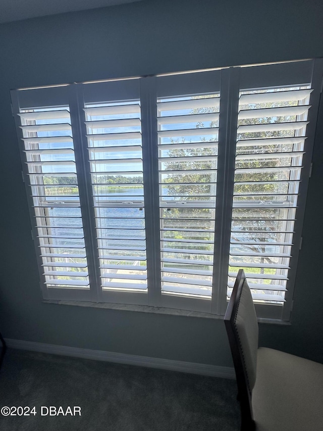 1021 Alabama Ave, Holly Hill, FL 32117 - dining area view of carpet and baseboards
