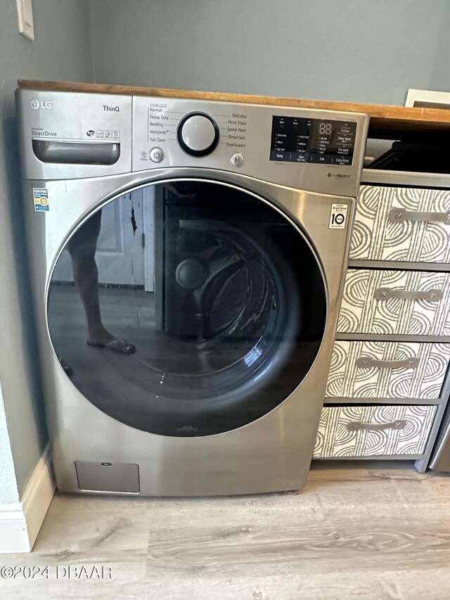1021 Alabama Ave, Holly Hill, FL 32117 - laundry area with washer / clothes dryer and baseboards