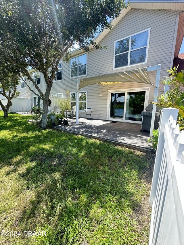 1021 Alabama Ave, Holly Hill, FL 32117 - rear view of house featuring a patio
