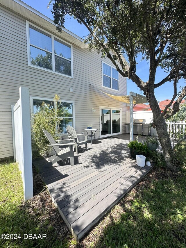 1021 Alabama Ave, Holly Hill, FL 32117 - rear view of house featuring a wooden deck