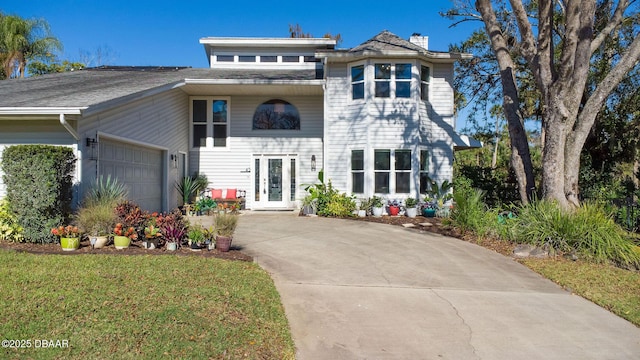 view of front of home featuring french doors and a garage