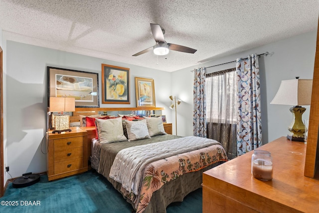 carpeted bedroom with ceiling fan and a textured ceiling