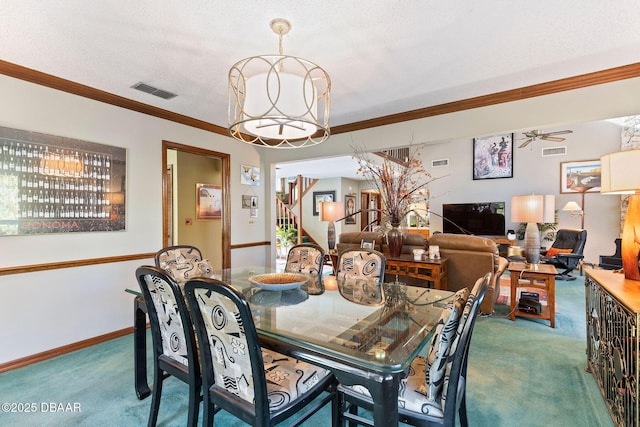 dining space with carpet, ceiling fan, ornamental molding, and a textured ceiling