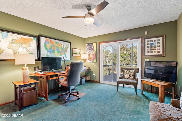 carpeted home office with ceiling fan and a textured ceiling