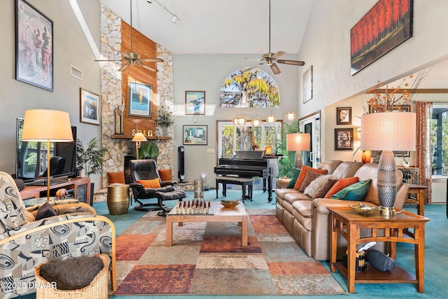 living room featuring ceiling fan, high vaulted ceiling, and track lighting