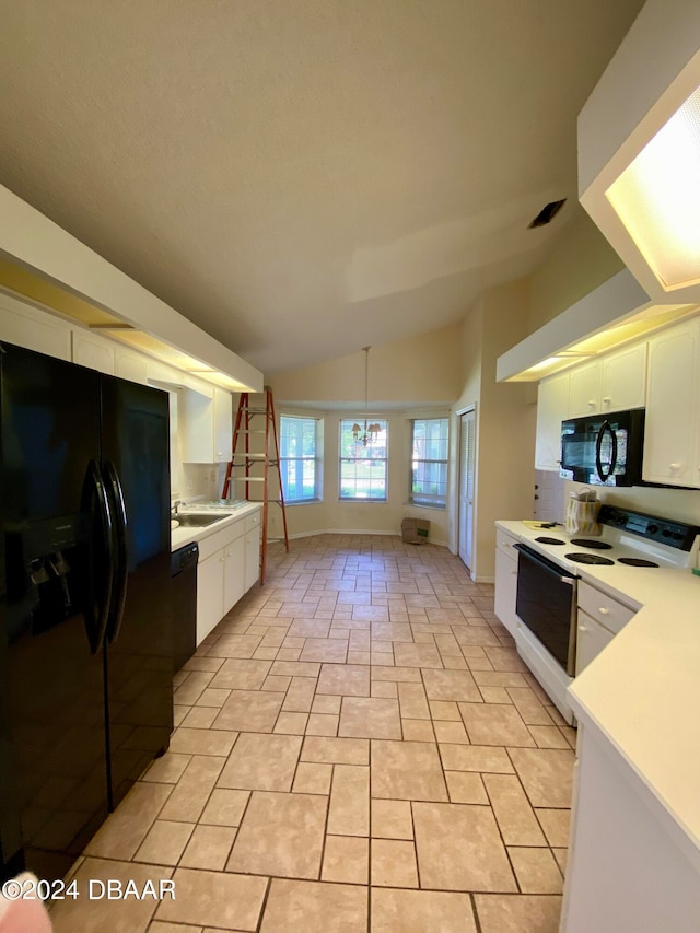 kitchen with black appliances, a chandelier, white cabinetry, light tile patterned floors, and lofted ceiling