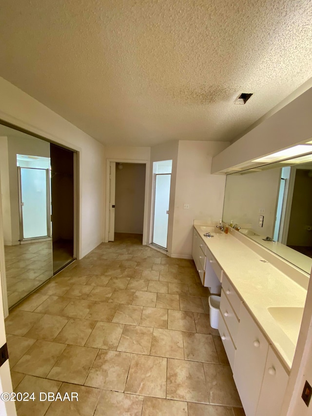 bathroom featuring vanity and a textured ceiling