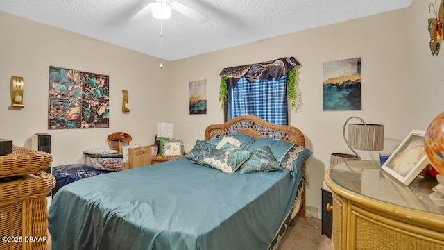 bedroom with a textured ceiling and ceiling fan