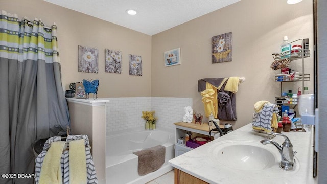 bathroom featuring vanity, a bath, and tile patterned flooring